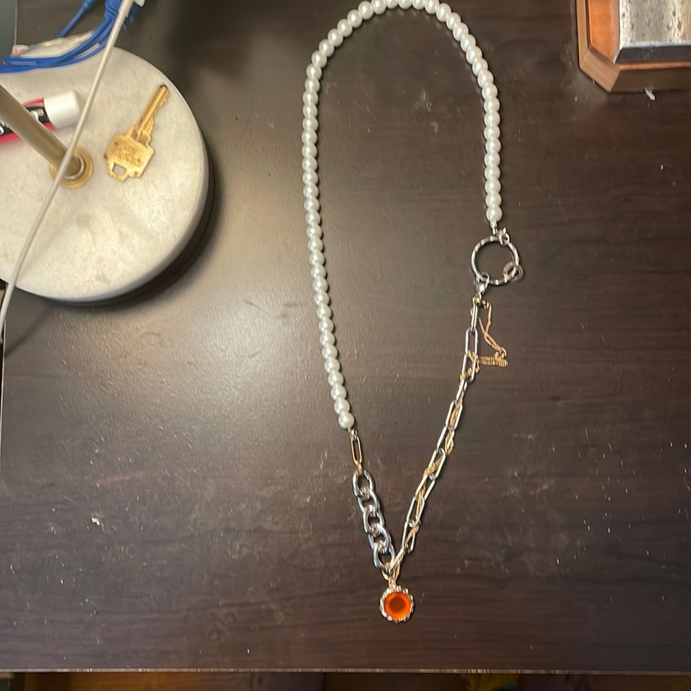 Womans mixed material necklace with pendant only tried on once